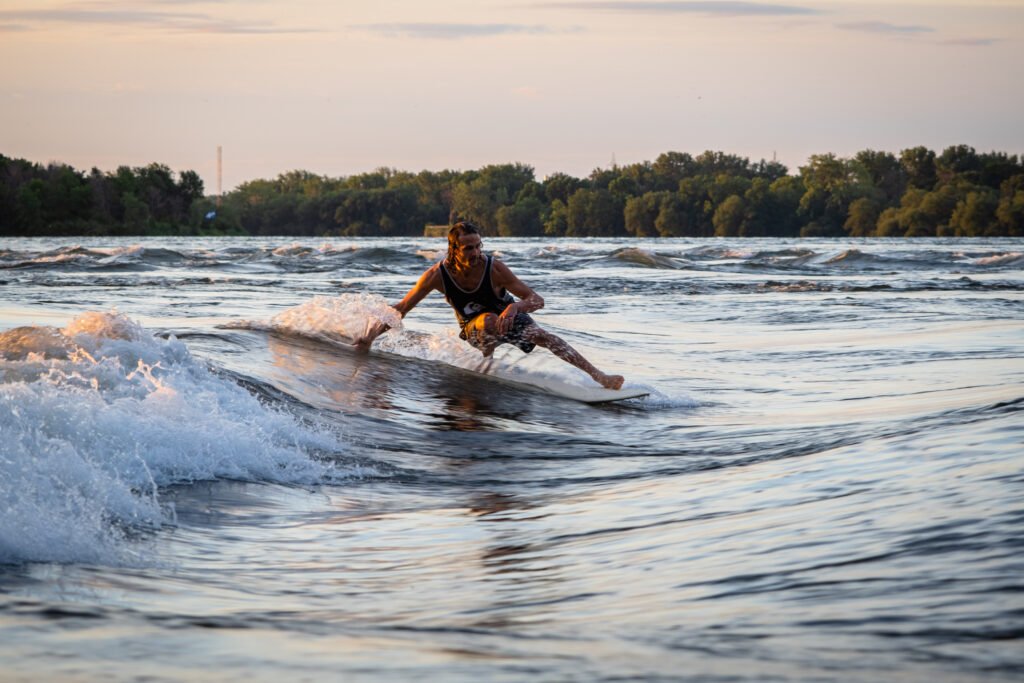 VAGUE A GUY - YUUAN - SUSAN PAIGE PHOTOGRAPHY-5594 Surfer on longboard in standing wave in Montreal Quebec