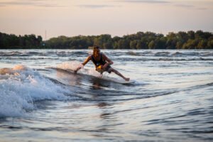 Surfer on longboard in standing wave in Montreal Quebec
